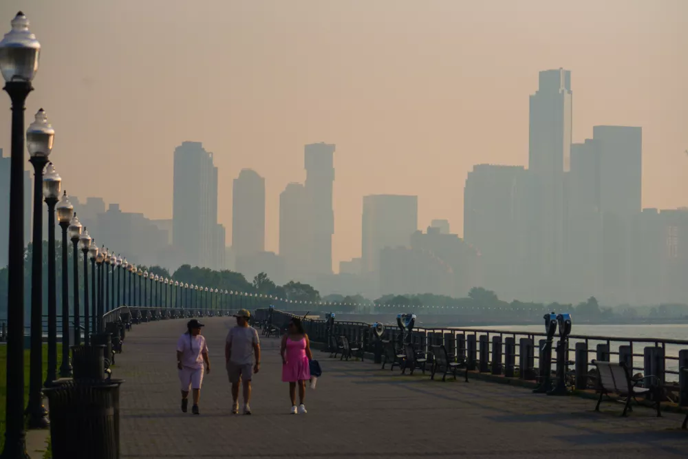 The Jersey City skyline is seen through a cover of wildfire smoke, in Jersey City, N.J., Friday, July 17, 2026. (AP Photo/Ryan Murphy)