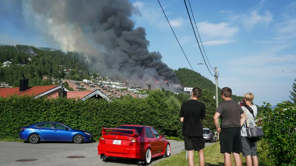 Smoke rises over terraced houses on fire in the Krokstadelva village in Drammen, Norway, Friday. July 17, 2026. (Thomas Fure/NTB Scanpix via AP)