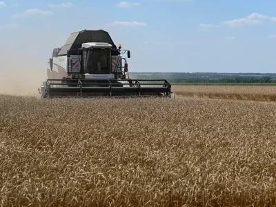 A combine harvests wheat in a field in the Rostov Region, Russia July 14, 2026. REUTERS/Sergey Pivovarov