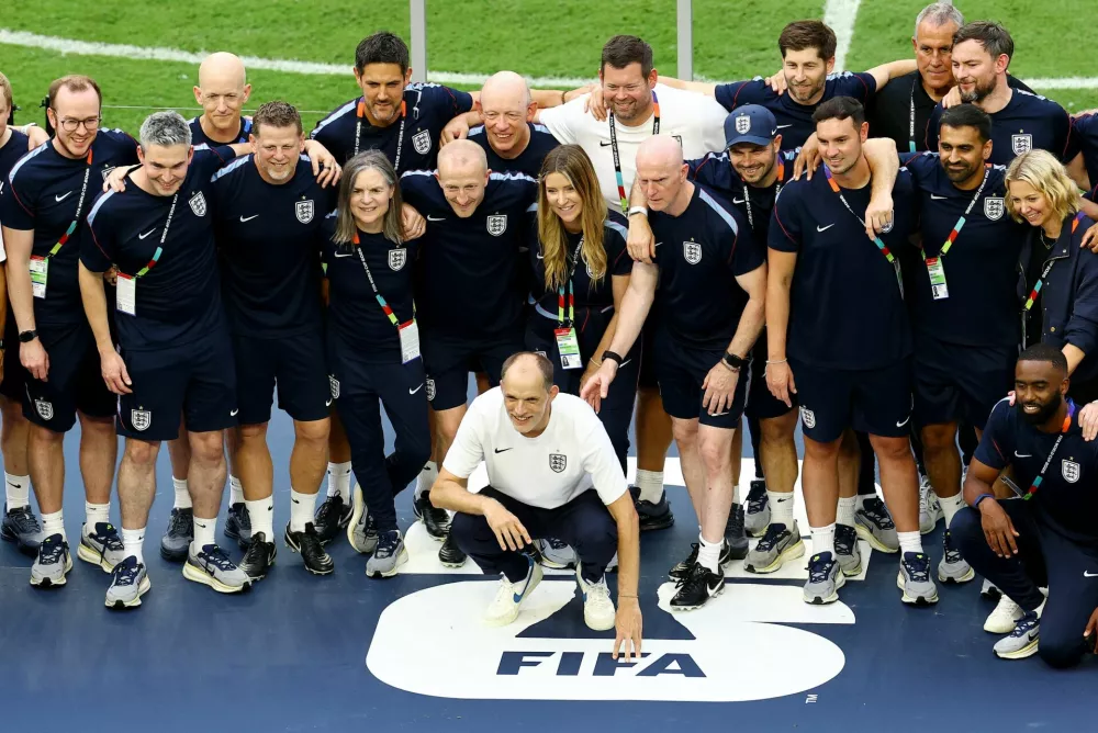 Soccer Football - FIFA World Cup 2026 - Bronze Final - France v England - Miami Stadium, Miami Gardens, Florida, U.S. - July 18, 2026 England manager Thomas Tuchel poses with England staff on the podium during the ceremony after the match REUTERS/Marco Bello