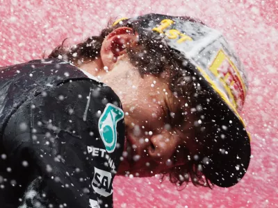 Formula One F1 - Belgian Grand Prix - Circuit de Spa-Francorchamps, Stavelot, Belgium - July 19, 2026 Mercedes' Andrea Kimi Antonelli celebrates with champagne on the podium after winning the Belgian Grand Prix REUTERS/Jakub Porzycki