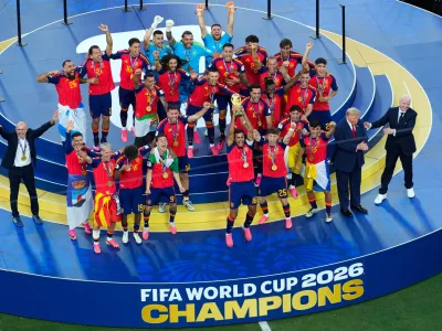 Spain players and coaches celebrate after the World Cup final soccer match between Spain and Argentina in East Rutherford, N.J., near New York, Sunday, July 19, 2026. (AP Photo/Yuki Iwamura)