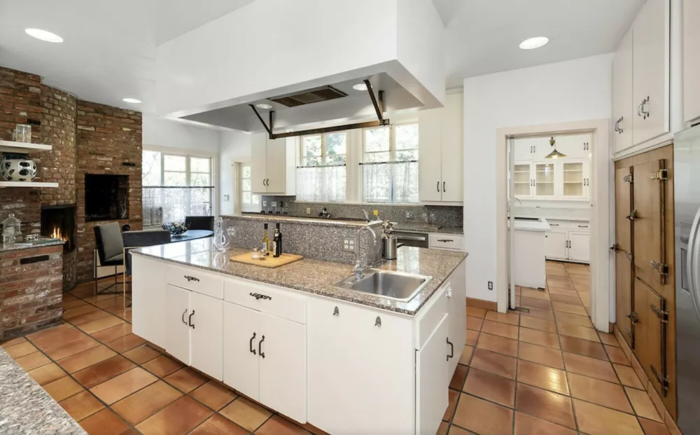 Photo&copy;2023: Zillow via Grosby GroupHelen Mirren and husband, Taylor Hackford have listed their Los Angeles mansion for sale at $ 17 Million Dollars. The property sits on 6.5 acres of land in the Hollywood Hills and the home measures 11,200 square feet contianing 8 bedrooms and 11 bathrooms. According to the listing, the gated enclave is both private sanctuary and distinguished setting for lavish entertaining. The fabulous residence combines tranquility, privacy and convenience. The spacious, elegant main residence has swimming pool, wide terrace for lounging, dining, entertaining. There's a separate 3-bedroom guest house plus a 5-car garage with an office and an apartment above. Refined and comfortable, with gorgeous city lights views, manicured gardens, and beautifully detailed interiors.,Image: 749130369, License: Rights-managed, Restrictions:, Model Release: no 