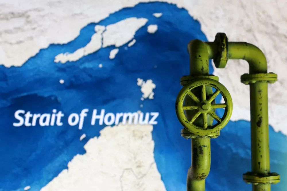FILE PHOTO: A map showing the Strait of Hormuz and a 3D printed oil pipeline are seen in this illustration taken March 23, 2026. REUTERS/Dado Ruvic/Illustration/File Photo/File Photo/File Photo/File Photo