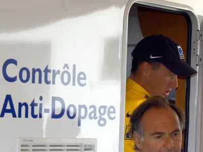 ** FILE ** Cyclist Lance Armstrong of Austin, Texas, walks out of the Tour de France's anti-doping control bus after the 16th stage of the Tour de France cycling race between Les Deux Alpes and La Plagne, French Alps, in this July 24, 2002 photo. Cycling's governing body said Friday, Sept. 9, 2005, it had received no evidence of doping by Lance Armstrong and criticized world doping authorities and a French sports newspaper for making allegations against the seven-time Tour de France champion. (AP Photo/Peter Dejong)