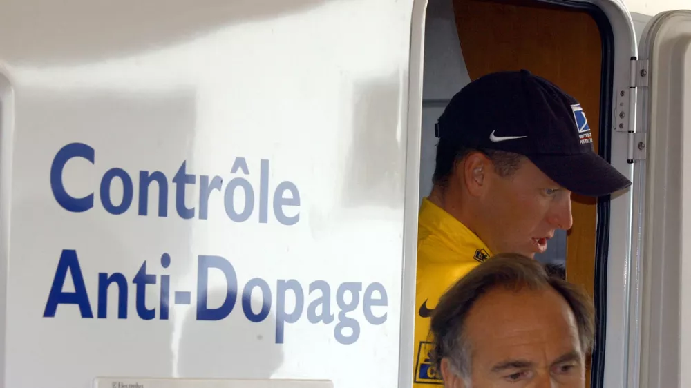 ** FILE ** Cyclist Lance Armstrong of Austin, Texas, walks out of the Tour de France's anti-doping control bus after the 16th stage of the Tour de France cycling race between Les Deux Alpes and La Plagne, French Alps, in this July 24, 2002 photo. Cycling's governing body said Friday, Sept. 9, 2005, it had received no evidence of doping by Lance Armstrong and criticized world doping authorities and a French sports newspaper for making allegations against the seven-time Tour de France champion. (AP Photo/Peter Dejong)