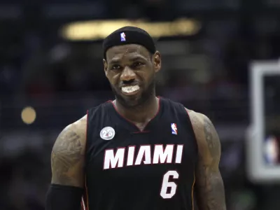 Miami Heat forward LeBron James is called with a foul against the Milwaukee Bucks in the second half of a NBA basketball game in Milwaukee, Wisconsin December 29, 2012. REUTERS/Darren Hauck (UNITED STATES - Tags: SPORT BASKETBALL)