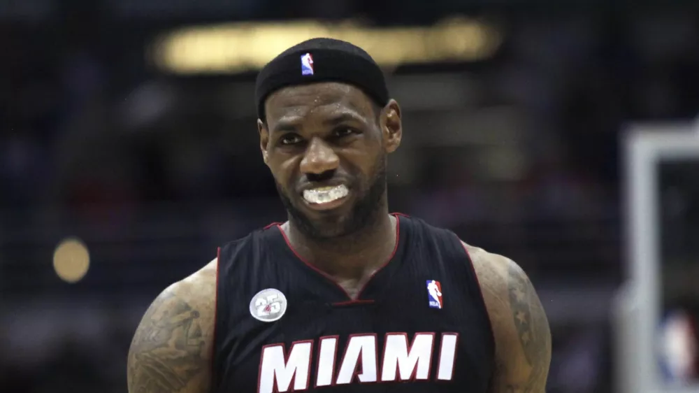 Miami Heat forward LeBron James is called with a foul against the Milwaukee Bucks in the second half of a NBA basketball game in Milwaukee, Wisconsin December 29, 2012. REUTERS/Darren Hauck (UNITED STATES - Tags: SPORT BASKETBALL)