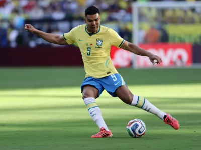 FILE - Brazil's Casemiro (5) kicks the ball in the first half during the World Cup Group C soccer match between Brazil and Morocco in East Rutherford, N.J., near New York, Saturday, June 13, 2026. (AP Photo/Adam Hunger, File(