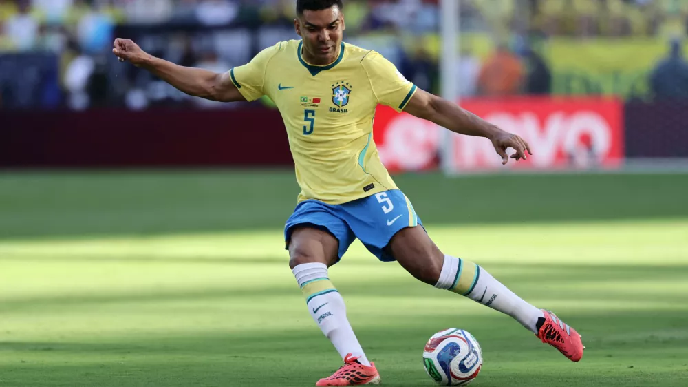 FILE - Brazil's Casemiro (5) kicks the ball in the first half during the World Cup Group C soccer match between Brazil and Morocco in East Rutherford, N.J., near New York, Saturday, June 13, 2026. (AP Photo/Adam Hunger, File(