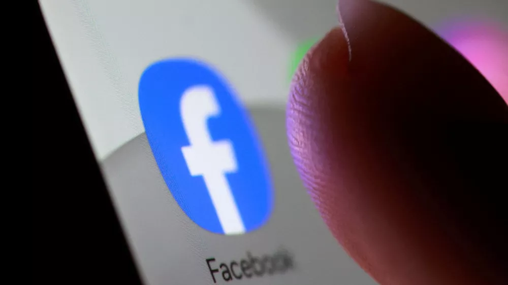 FILE PHOTO: Facebook app icon is seen on a smartphone in this illustration taken October 27, 2025. REUTERS/Dado Ruvic/Illustration/File Photo
