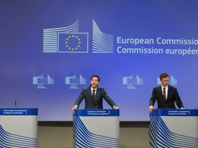 European Commission spokesman Thomas Regnier, left, speaks during a media conference regarding a fine against Google at EU headquarters in Brussels, Thursday, July 23, 2026. (AP Photo/Virginia Mayo)