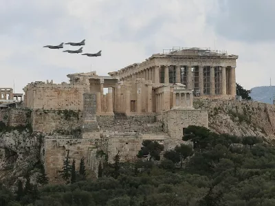 FILE PHOTO: Military planes fly above the Acropolis of Athens, as part of a military parade marking the country's Independence Day, in Athens, Greece, March 25, 2026. REUTERS/Louisa Gouliamaki/File Photo
