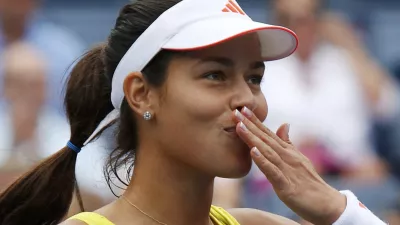 Ana Ivanovic of Serbia blows a kiss after defeating Tsvetana Pironkova of Bulgaria during their women's singles match at the U.S. Open tennis tournament in New York September 3, 2012.     REUTERS/Eduardo Munoz (UNITED STATES - Tags: SPORT TENNIS)