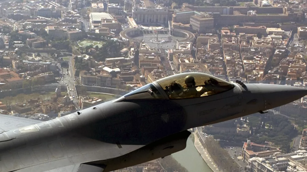 ** FILE ** In this photo released by the Italian Air Force Friday, April 8, 2005, an Italian Air Force F16 patrols the air space above St. Peter's Basilica, seen top center, at the Vatican. Italian Air Force will deploy F16 jet planes as part of the security system for the arrival in Rome of U.S. President George W. Bush scheduled for Friday, June 8, 2007. (AP Photo/Aeronautica Militare Italiana, HO)