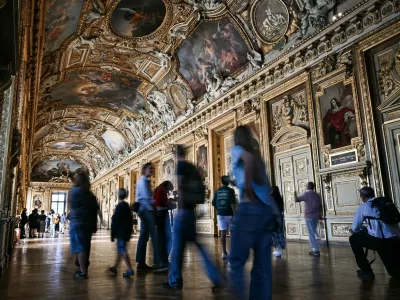 Visitors arrive during the reopening to the public of the Apollo Gallery, where French crown jewels worth 88 million euros were stolen in 2025 in a brazen heist, at the Mus&eacute;e du Louvre in Paris on July 22, 2026.,Image: 1117855123, License: Rights-managed, Restrictions:, Model Release: no 