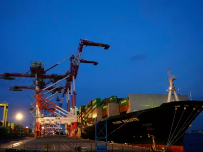 FILE -A container ship is docked at a cargo terminal in Tokyo, Wednesday, April 9, 2025. (AP Photo/Hiro Komae, File)