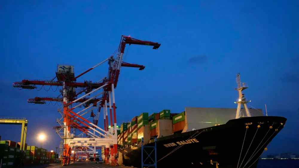 FILE -A container ship is docked at a cargo terminal in Tokyo, Wednesday, April 9, 2025. (AP Photo/Hiro Komae, File)