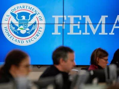 FILE - People work at the Federal Emergency Management Agency headquarters in Washington, Jan. 24, 2026. (AP Photo/Julia Demaree Nikhinson, File)