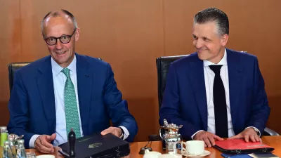 German Chancellor Friedrich Merz, left, and Thorsten Frei, Head of the Federal Chancellery and Federal Minister for Special Tasks attend the cabinet meeting at the chancellery in Berlin, Germany, Wednesday, July 22, 2026. (Sebastian Gollnow/dpa via AP)