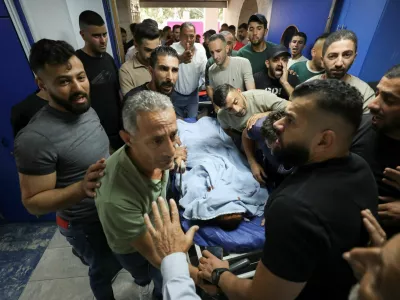 Palestinians gather around the body of a man who was killed during a confrontation with Israeli settlers, at a hospital in the Israeli-occupied West Bank city of Nablus, July 24, 2026.REUTERS/Nidal Eshtayeh