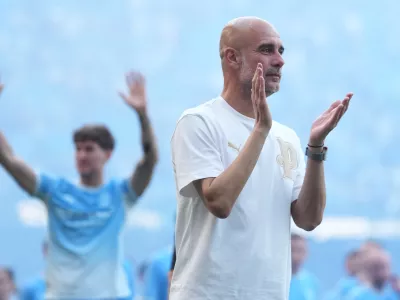 FILE - Manchester City's head coach Pep Guardiola applauds the fans after his last game with the club after a Premier League soccer match between Manchester City and Aston Villa in Manchester, England, May 24, 2026. (AP Photo/Alastair Grant, File)