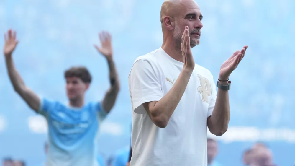 FILE - Manchester City's head coach Pep Guardiola applauds the fans after his last game with the club after a Premier League soccer match between Manchester City and Aston Villa in Manchester, England, May 24, 2026. (AP Photo/Alastair Grant, File)