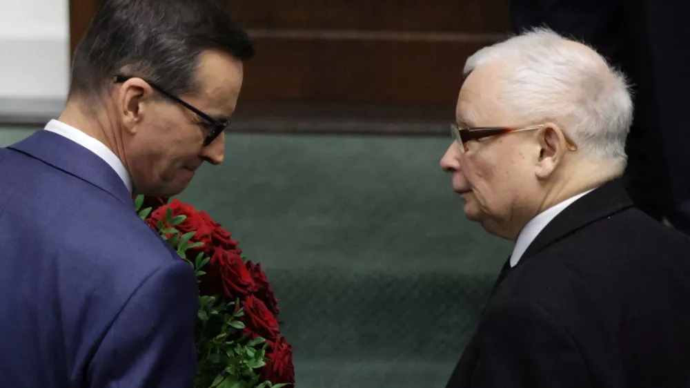 Leader of Law and Justice (PiS) Jaroslaw Kaczynski looks at Poland's Prime Minister Mateusz Morawiecki on the day he presents his government's programme and asks parliament for a vote of confidence in Parliament in Warsaw, Poland, December 11, 2023. Slawomir Kaminski/Agencja Wyborcza.pl via REUTERS ATTENTION EDITORS - THIS IMAGE WAS PROVIDED BY A THIRD PARTY. POLAND OUT. NO COMMERCIAL OR EDITORIAL SALES IN POLAND.