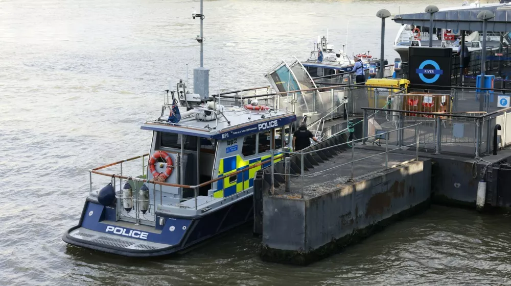 A Metropolitan police boat is seen moored near the scene of an incident involving a boat crashing into the bridge in central London on July 24, 2026, injuring a number of officers from the Met's Marine Policing Unit. Five London police officers were injured Friday after their boat patrolling the River Thames struck Westminster Bridge and they went into the water, the UK capital's Metropolitan Police Service said.,Image: 1118307672, License: Rights-managed, Restrictions:, Model Release: no 
