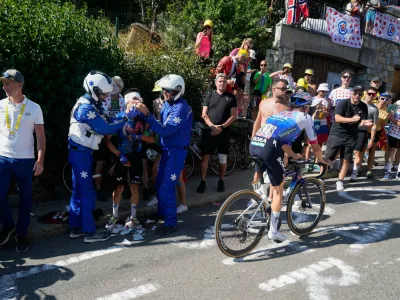 Colombia's Einer Rubio receives medical attention during the nineteenth stage of the Tour de France cycling race with start in Gap and finish in Alpe d'Huez, France, Friday, July 24, 2026. (AP Photo/Mosa'ab Elshamy)