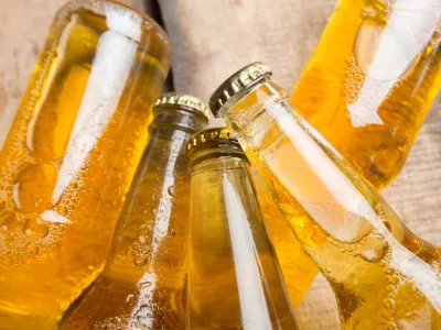 Beer bottles on a wooden table.