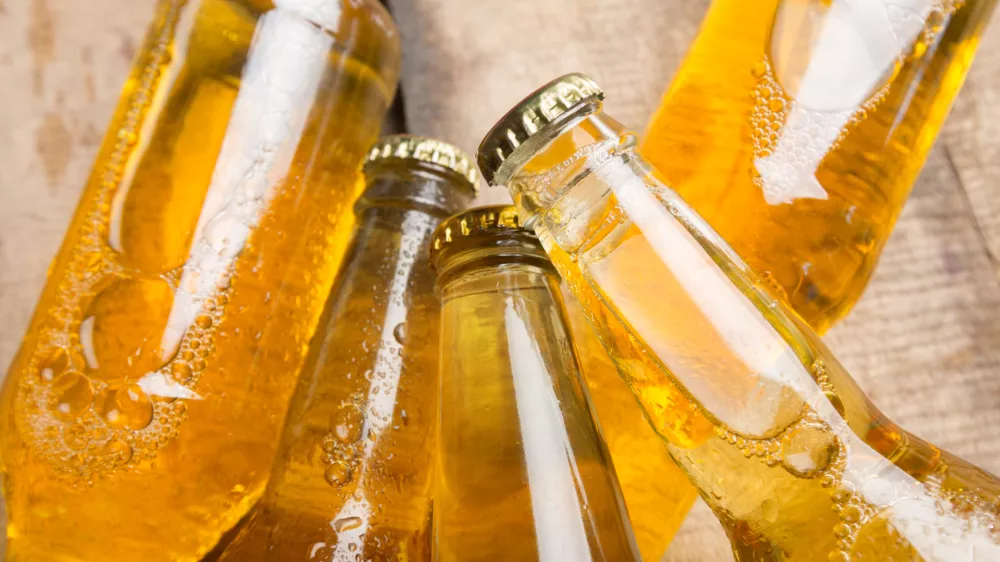 Beer bottles on a wooden table.