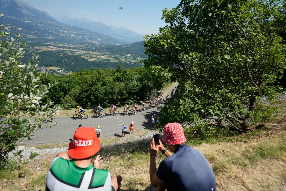 The pack rides during the nineteenth stage of the Tour de France cycling race with start in Gap and finish in Alpe d'Huez, France, Friday, July 24, 2026. (AP Photo/Mosa'ab Elshamy)