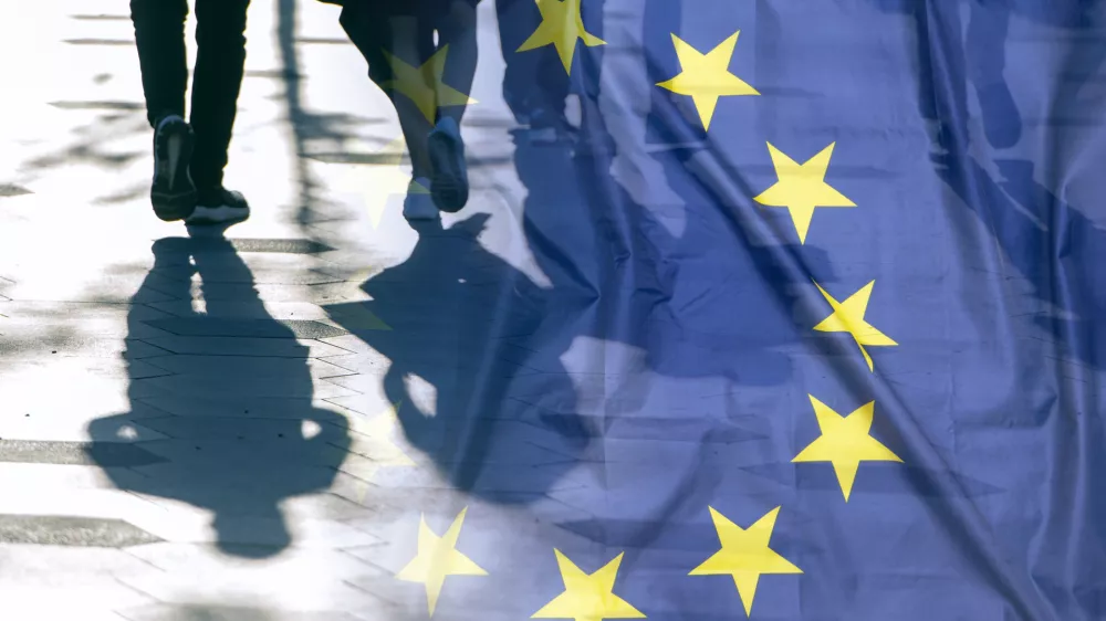 EU or European Union Flag and shadows of people, concept political picture
