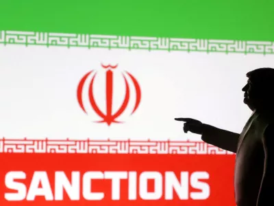 FILE PHOTO: A 3D-printed miniature model depicting U.S. President Donald Trump, Iran flag and word "Sanctions" in this illustration created on April 17, 2025. REUTERS/Dado Ruvic/Illustration//File Photo