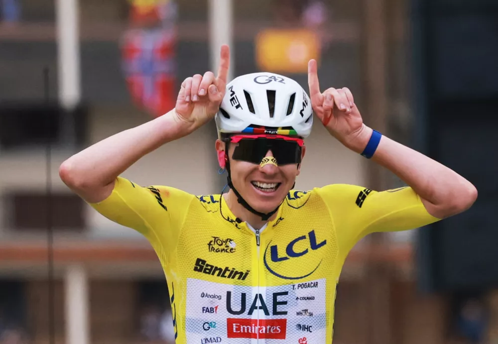 Cycling - Tour de France - Stage 20 - Le Bourg d'Oisans to Alpe d'Huez - Alpe d'Huez, France - July 25, 2026 UAE Team Emirates XRG's Tadej Pogacar wearing the yellow jersey reacts at the end of stage 20 REUTERS/Stephanie Lecocq