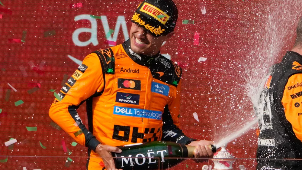 McLaren driver Lando Norris of Britain celebrates after winning the Formula One Hungarian Grand Prix auto race, at the Hungaroring racetrack in Mogyorod, near Budapest, Hungary, Sunday, July 26, 2026. (AP Photo/Darko Bandic)