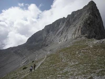 KATERINI (GREECE), Aug. 9, 2018 Photo taken on Aug. 8, 2018 shows mountaineers walking on the main path to the peak ''Throne of Zeus'', at Mount Olympus, northern Greece. Mount Olympus is the highest mountain in Greece with the highest peak of 2,917 meters. Olympus is notable in Greek mythology as the home of the Greek gods.,Image: 381897454, License: Rights-managed, Restrictions:, Model Release: no