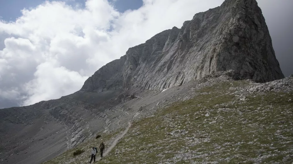 KATERINI (GREECE), Aug. 9, 2018 Photo taken on Aug. 8, 2018 shows mountaineers walking on the main path to the peak ''Throne of Zeus'', at Mount Olympus, northern Greece. Mount Olympus is the highest mountain in Greece with the highest peak of 2,917 meters. Olympus is notable in Greek mythology as the home of the Greek gods.,Image: 381897454, License: Rights-managed, Restrictions:, Model Release: no