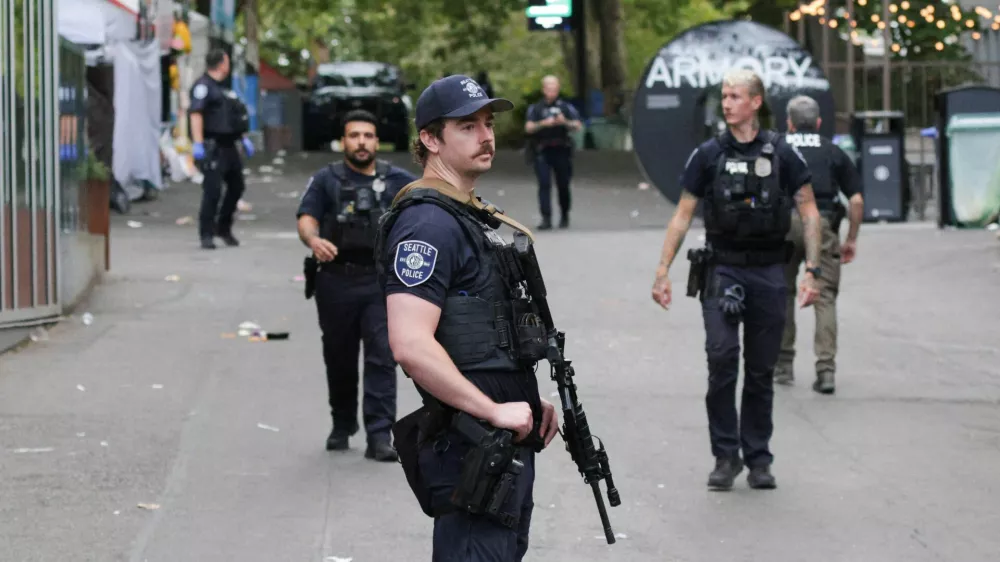 Police officers stand guard at a site after Seattle Police responded to what they described as a shooting with "multiple" victims at Seattle Center, which was hosting a Bite of Seattle food festival, in Seattle, Washington, U.S., July 26, 2026. REUTERS/Jason Redmond