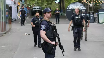 Police officers stand guard at a site after Seattle Police responded to what they described as a shooting with "multiple" victims at Seattle Center, which was hosting a Bite of Seattle food festival, in Seattle, Washington, U.S., July 26, 2026. REUTERS/Jason Redmond
