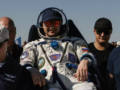 Specialists carry Roscosmos cosmonaut Sergey Mikaev after he returned from the International Space Station (ISS) aboard the Soyuz MS-28 spacecraft, following its landing in a remote area near Zhezkazgan, Kazakhstan, July 26, 2026. Roscosmos/Artyom Pylayev/Handout via REUTERS ATTENTION EDITORS - THIS IMAGE HAS BEEN SUPPLIED BY A THIRD PARTY. MANDATORY CREDIT.