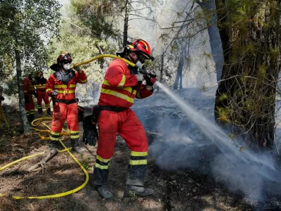 Military Emergencies Unit (UME) put out a wildfire in San Martin de Valdeiglesias, Madrid, Spain July 26, 2026. REUTERS/Ana Beltran
