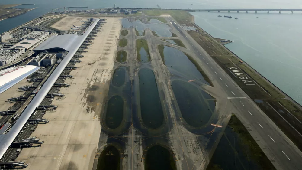 An aerial view shows a flooded runway at Kansai airport, which is built on a man-made island in a bay, after Typhoon Jebi hit the area, in Izumisano, western Japan, in this photo taken by Kyodo September 5, 2018. Mandatory credit Kyodo/via REUTERS ATTENTION EDITORS - THIS IMAGE WAS PROVIDED BY A THIRD PARTY. MANDATORY CREDIT. JAPAN OUT. NO COMMERCIAL OR EDITORIAL SALES IN JAPAN.