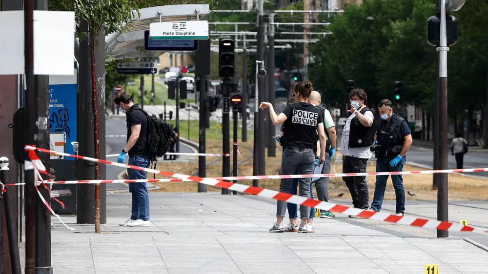 Police officers work at the site of a knife attack near the Porte de Clichy in Paris, France July 27, 2026. REUTERS/Abdul Saboor
