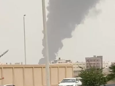 Plume of smoke rises, as Yemen's Iran-aligned Houthis said on Saturday they carried out operations targeting Saudi Aramco facilities in Jizan and Yanbu, according to a statement by the group's military spokesperson Yahya Sare, in Jizan, Saudi Arabia July 25, 2026, in this screen grab obtained from a social media video. Social Media/via REUTERS THIS IMAGE HAS BEEN SUPPLIED BY A THIRD PARTY. NO RESALES. NO ARCHIVES. NEWS USE ONLY.  VERIFICATION: -Road layout, buildings and business signage matched archive and satellite images -Coordinates: 16.847588969791012, 42.606274557696054 -Date verified by a statement from Houthi military spokesperson, Yahya Sare, saying they carried out operations against Aramco facilities in Saudi's Jizan and Yanbu -There was an emergency alert on Saturday morning for Jizan residents issued by the Saudi Civil Defense on the national early warning platform -NASA FIRMS detected thermal activity, where it hasn't previously been seen, at the Jizan Saudi Aramco refinery on July 25 -No older versions found posted online before July 25