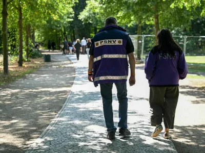 Care providers walk on Ahornsteig path in Tiergarten park, after a deadly attack in which a vehicle crashed into a crowd near Berlin's annual Christopher Street Day Pride parade on Saturday evening, leaving one dead and multiple others injured, in Berlin, Germany, July 27, 2026. REUTERS/Annegret Hilse
