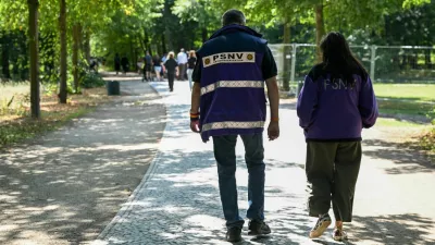 Care providers walk on Ahornsteig path in Tiergarten park, after a deadly attack in which a vehicle crashed into a crowd near Berlin's annual Christopher Street Day Pride parade on Saturday evening, leaving one dead and multiple others injured, in Berlin, Germany, July 27, 2026. REUTERS/Annegret Hilse