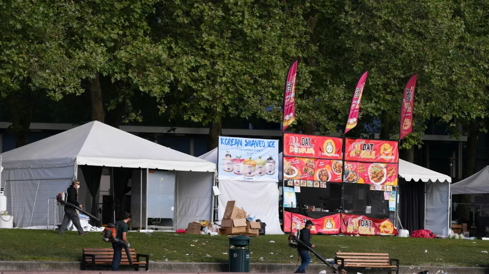 Cleanup continues at the Space Needle the day after a shooting at Seattle Center during the Bite of Seattle food festival, Monday, July 27, 2026. (AP Photo/Lindsey Wasson)