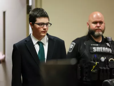 Colt Gray, the 16-year-old Apalachee High School shooting suspect, is led in by deputies for his sentencing at Barrow County Superior Court, Monday, July 27, 2026, in Winder, Ga. (Jason Getz/Atlanta Journal-Constitution via AP, Pool)
